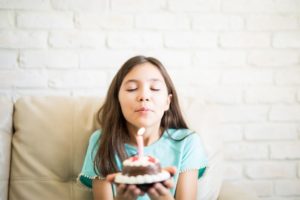 10 years old girl with a present