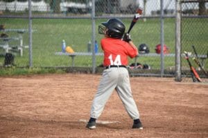 8 years old boy playing baseball