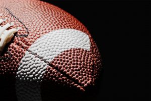 FOOTBALL on a dark background