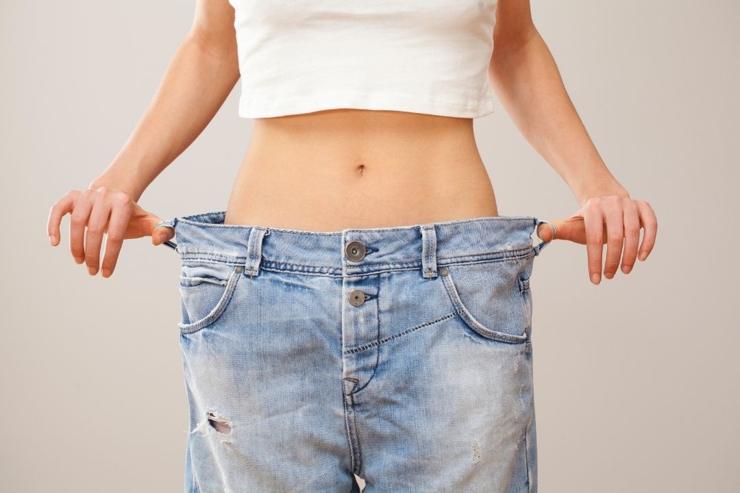 WOMAN LOOSING WEIGHT
