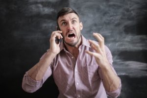 anxious angry guy on the phone