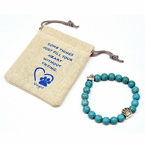 blue beads bracelet with a white gift bag