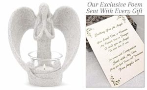 angel figurine holding a candle