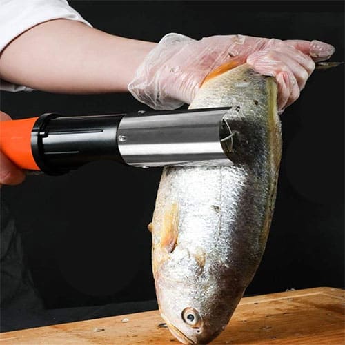 cook skinning a fish