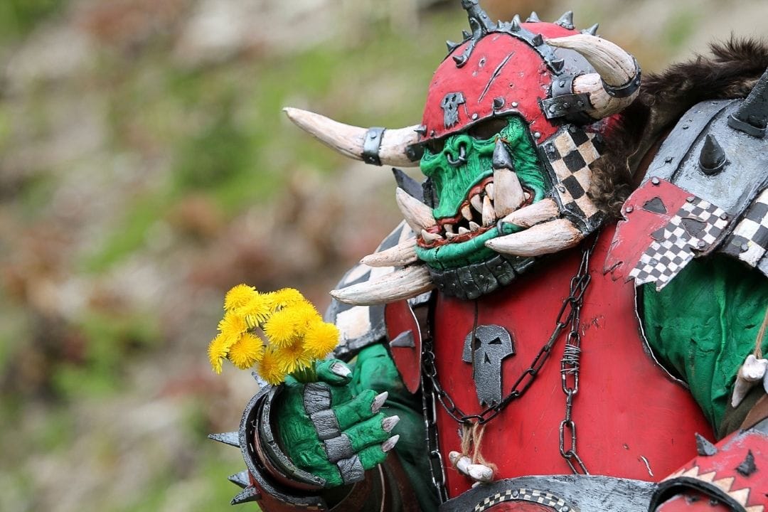 warcraft monster giving a flower as a present