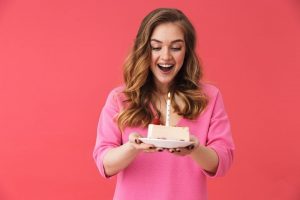 woman with a birthday cake